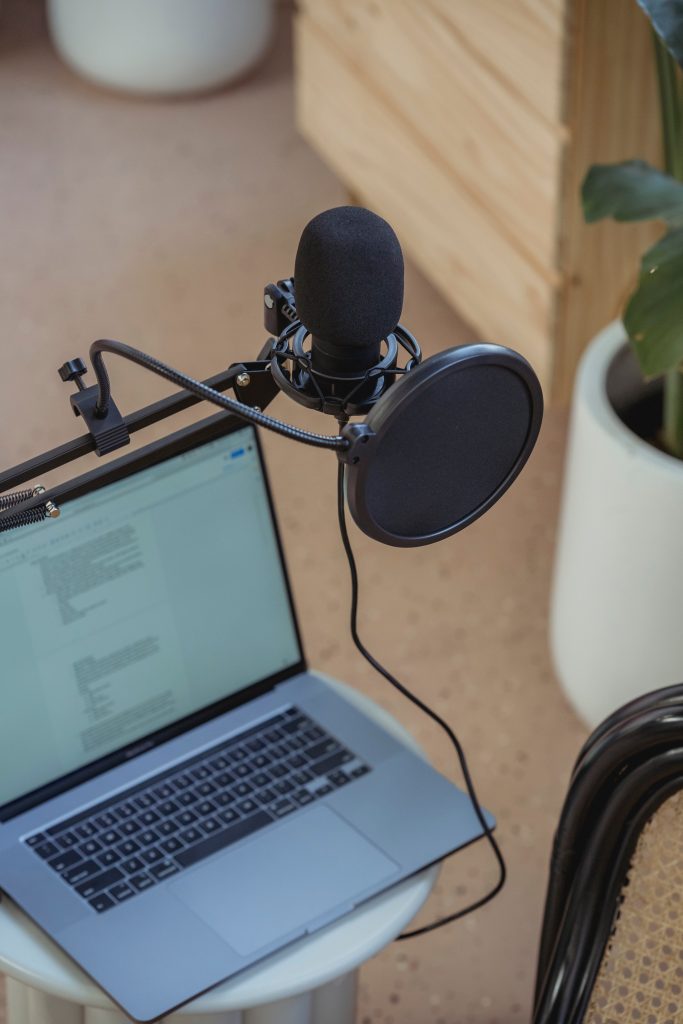 Laptop set up with a microphone for recording a science podcast